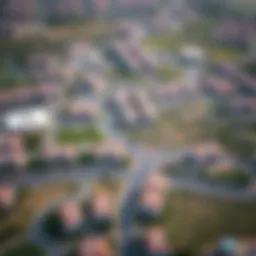 Aerial view of Muhaisnah showcasing its residential areas and parks